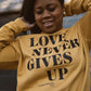Love Never Gives Up This Adult Drop Shoulder Sweatshirt